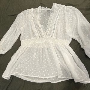Sheer white blouse with long sleeves and really cute details!